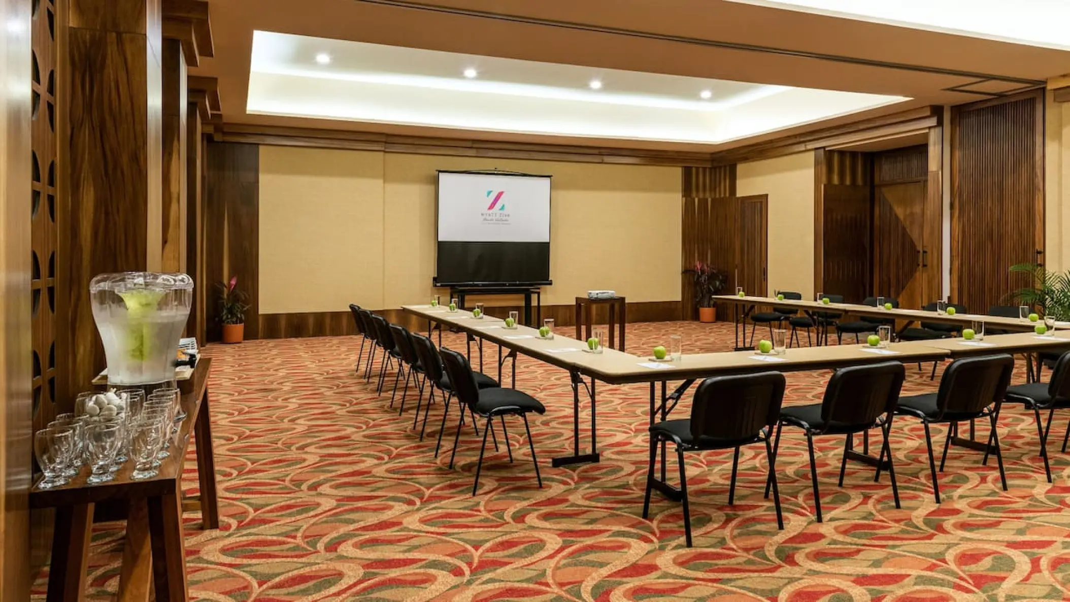 Indoor wedding reception or event room with U-shaped table setup at Hyatt Ziva Puerto Vallarta