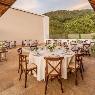 Sky Penthouse Terrace wedding reception with round tables at Hyatt Ziva Puerto Vallarta