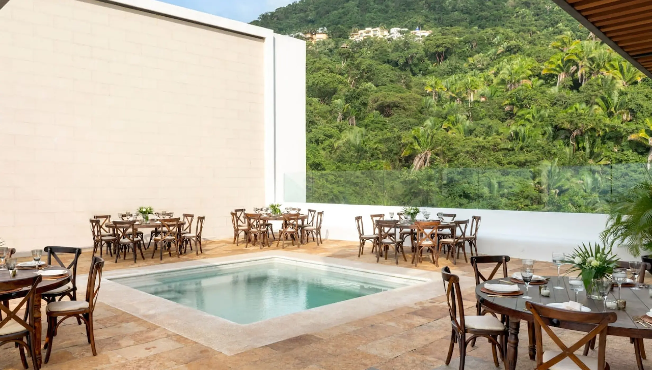 Sky penthouse terrace reception with dinner tables and pool at Hyatt Ziva Puerto Vallarta