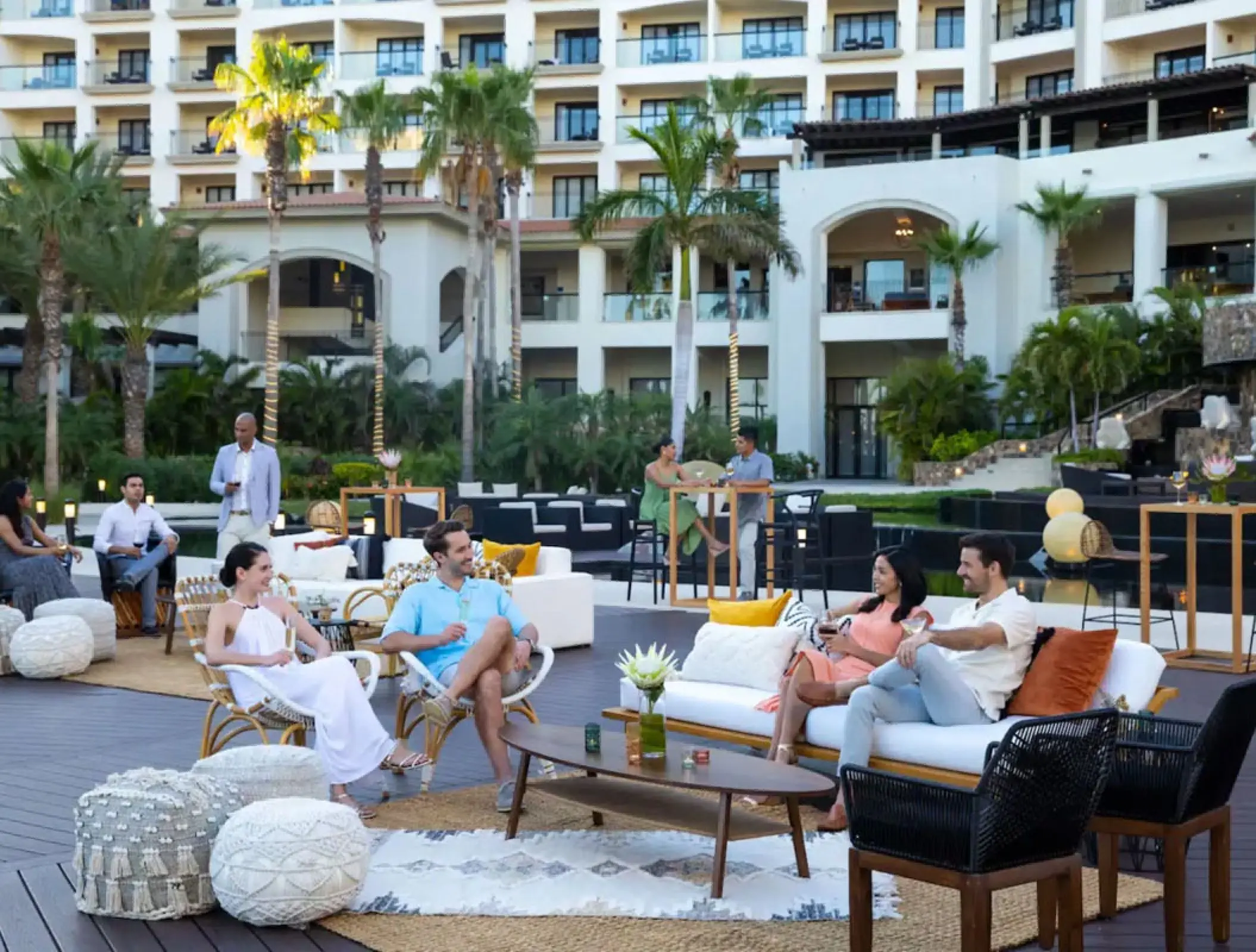 Wedding guests relaxing at an outdoor lounge at Hyatt Ziva Los Cabos, Cabo San Lucas