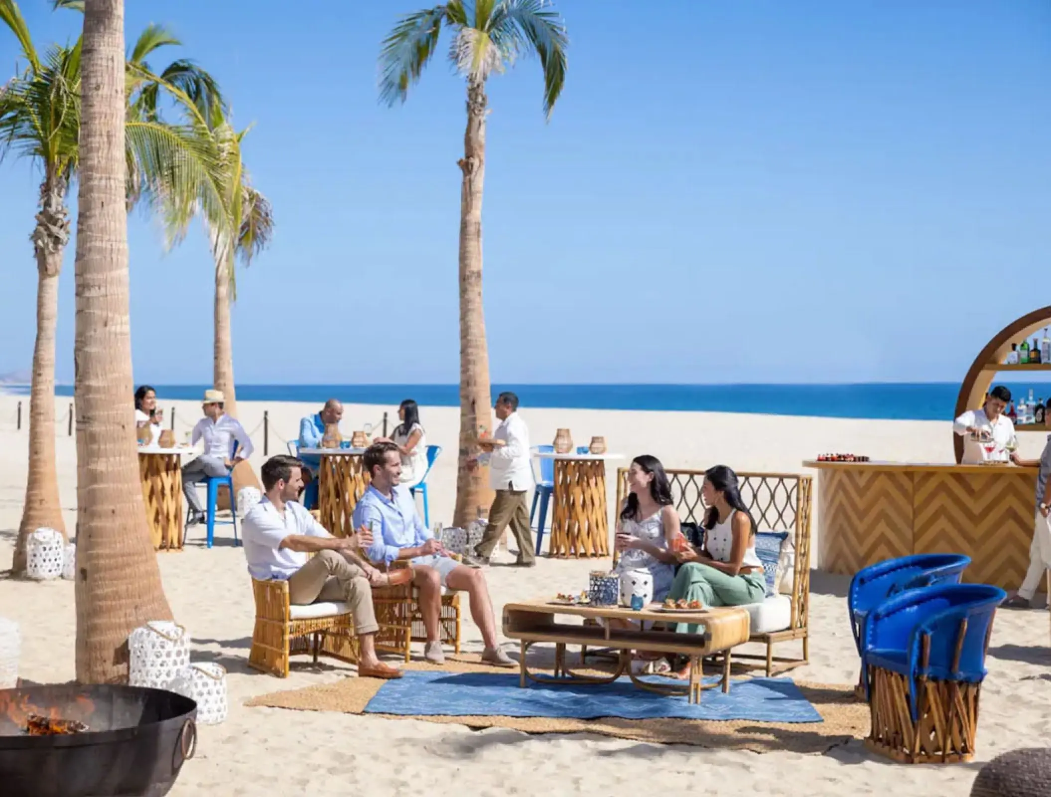 Guests enjoying a beach cocktail reception at Hyatt Ziva Los Cabos, Cabo San Lucas