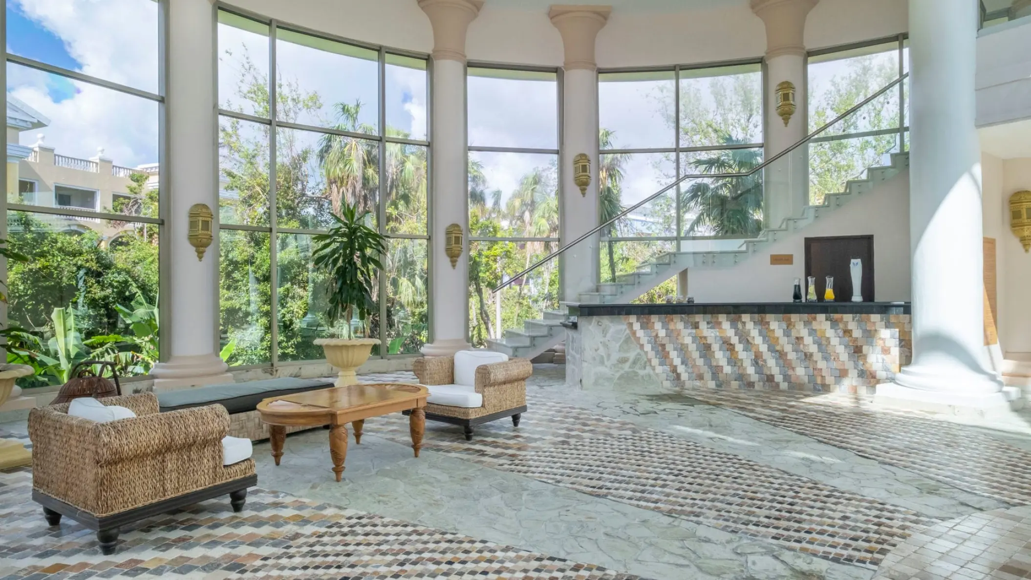 JOIA Paraiso by Iberostar lounge with floor-to-ceiling windows and marble pillars, Riviera Maya