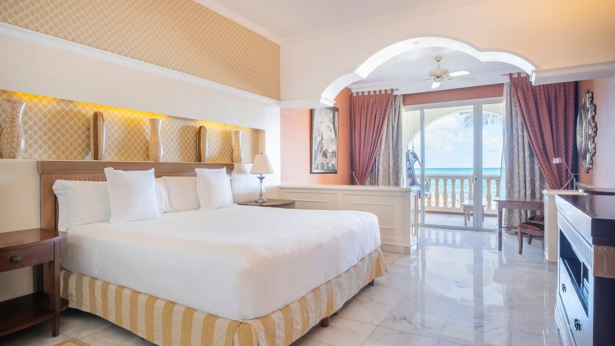 Oceanfront bedroom with white linens and private balcony at JOIA Paraiso by Iberostar, Riviera Maya