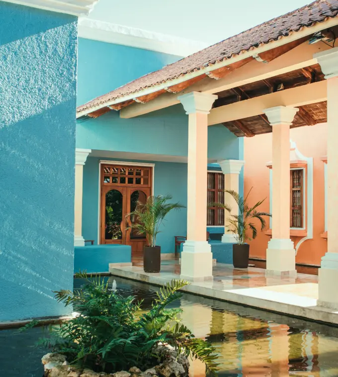 Colorful colonial-style courtyard and reflection pool at Iberostar Paraiso Beach, Riviera Maya