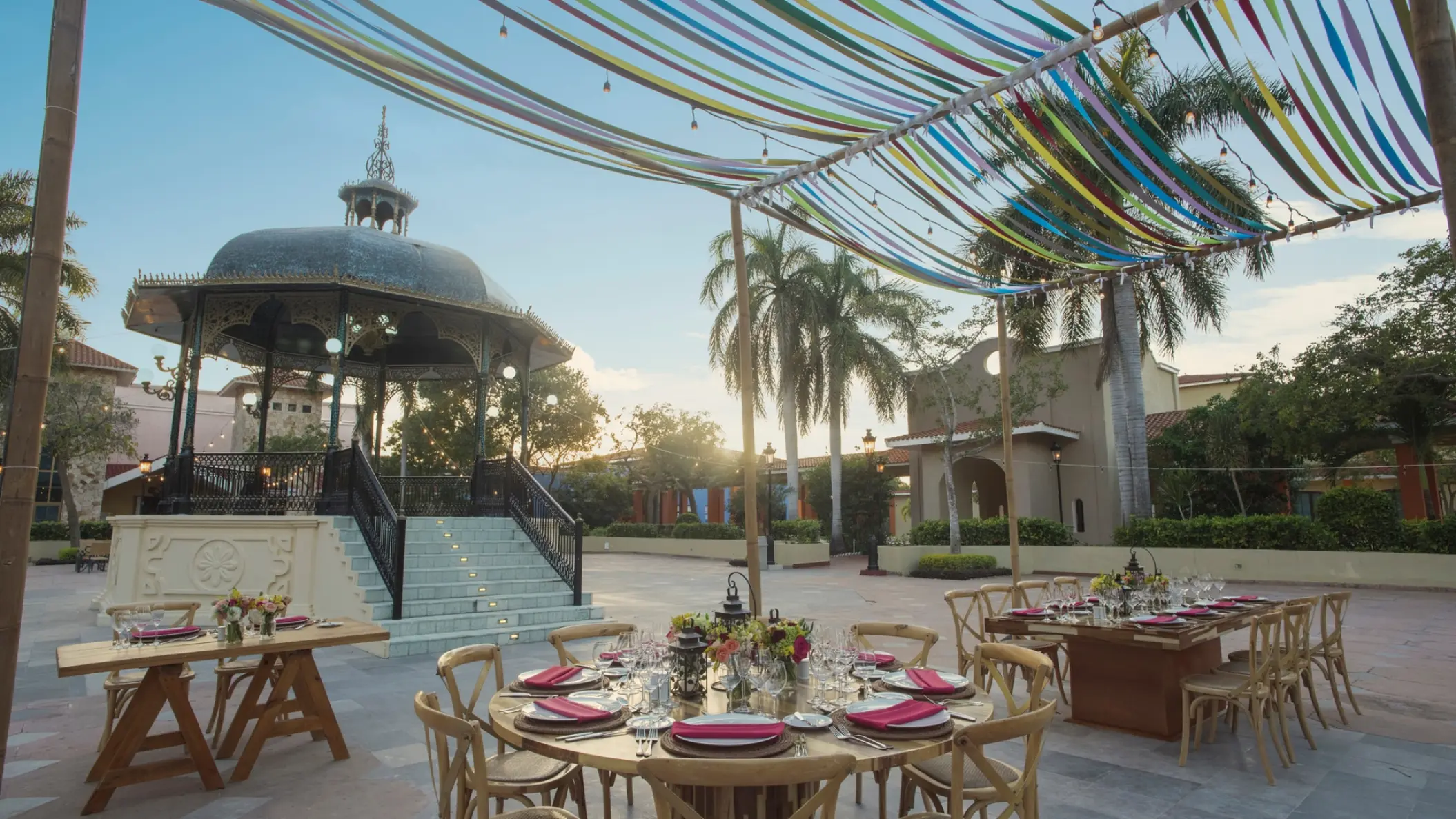 Plaza wedding reception under colorful ribbons at Iberostar Paraiso Del Mar, Riviera Maya