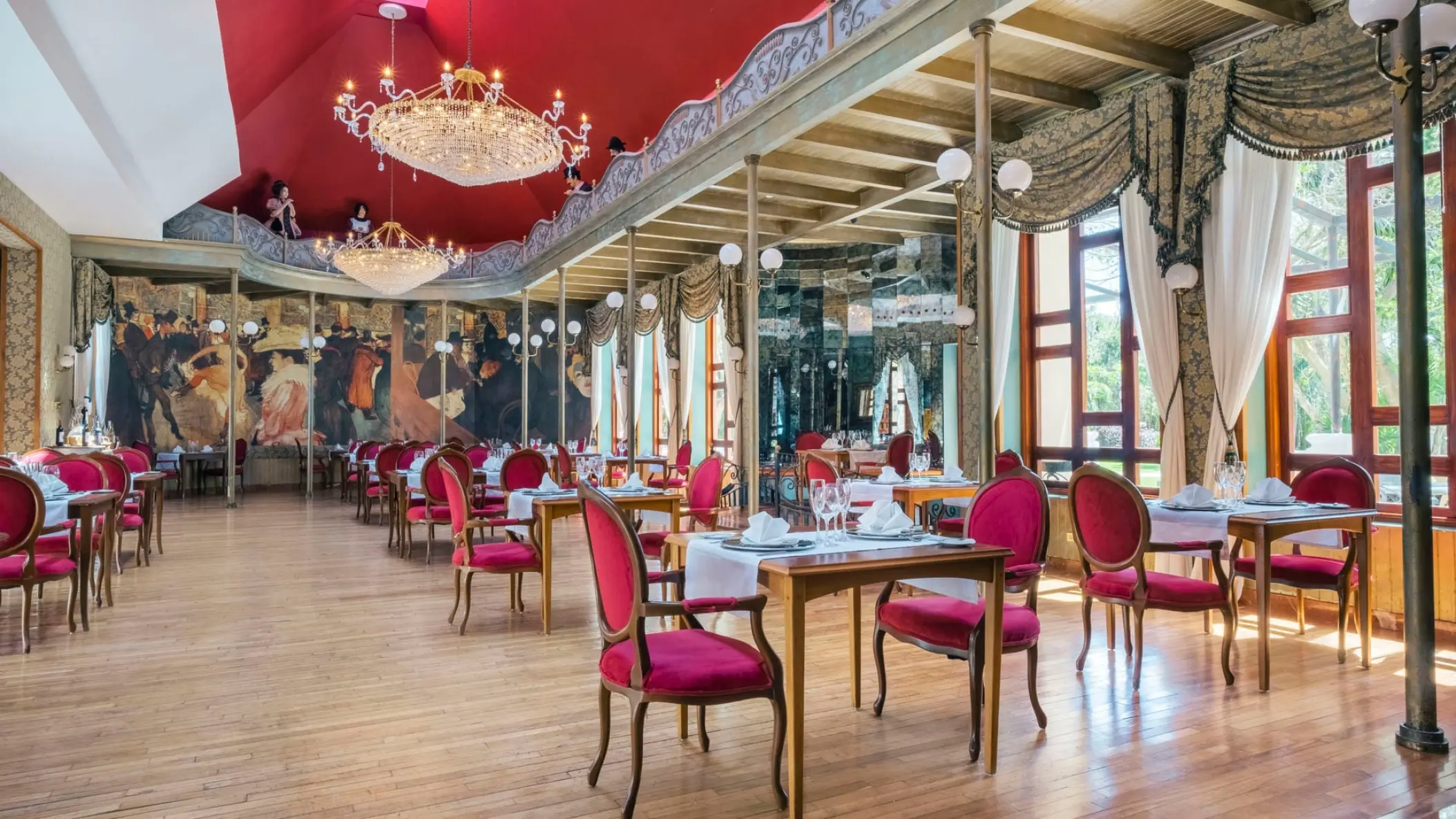 Iberostar Selection Paraiso Maya restaurant with red chairs and chandeliers, Riviera Maya