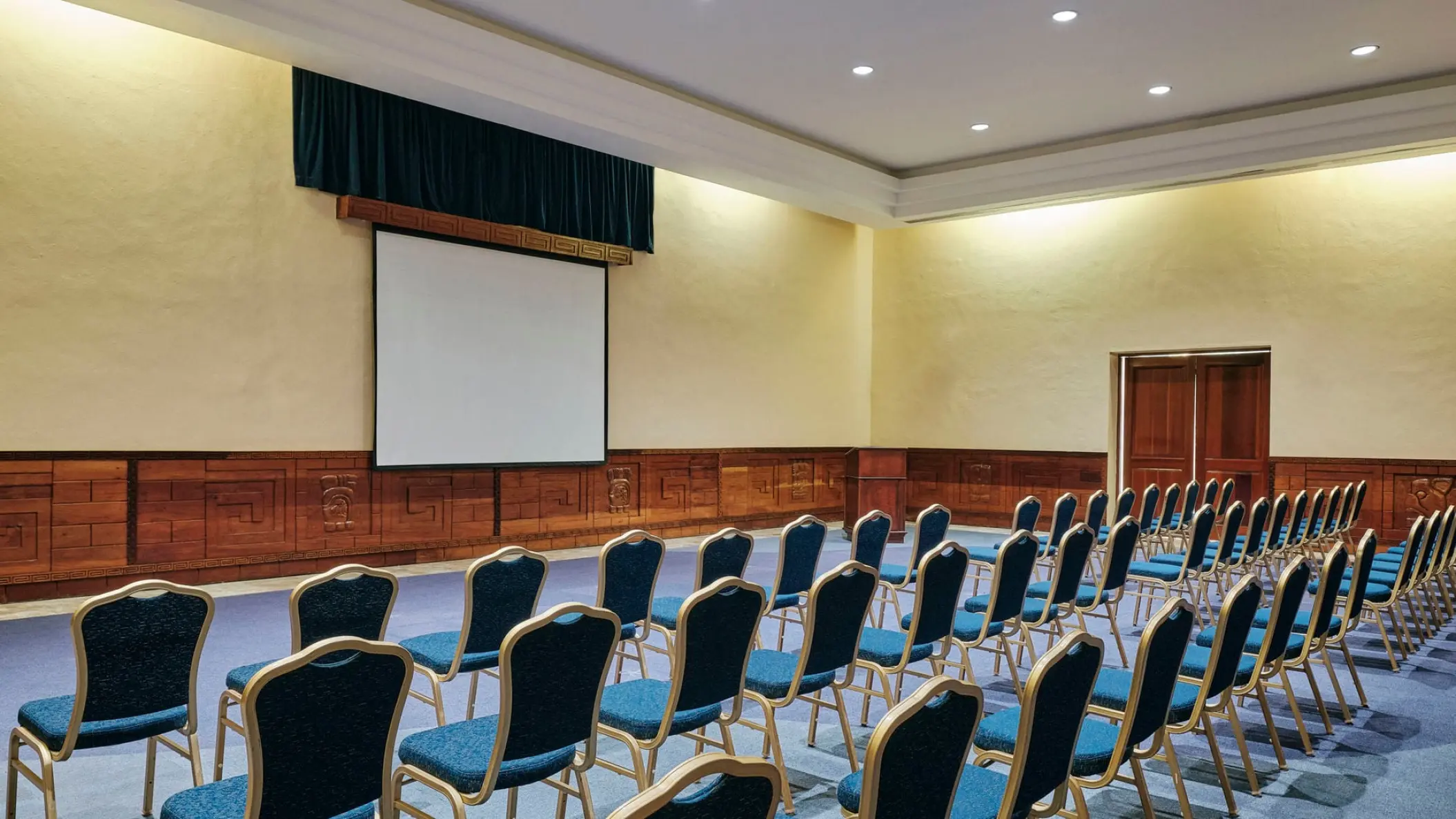 Theater-style seating and projection screen at Iberostar Waves Quetzal, Playa Del Carmen