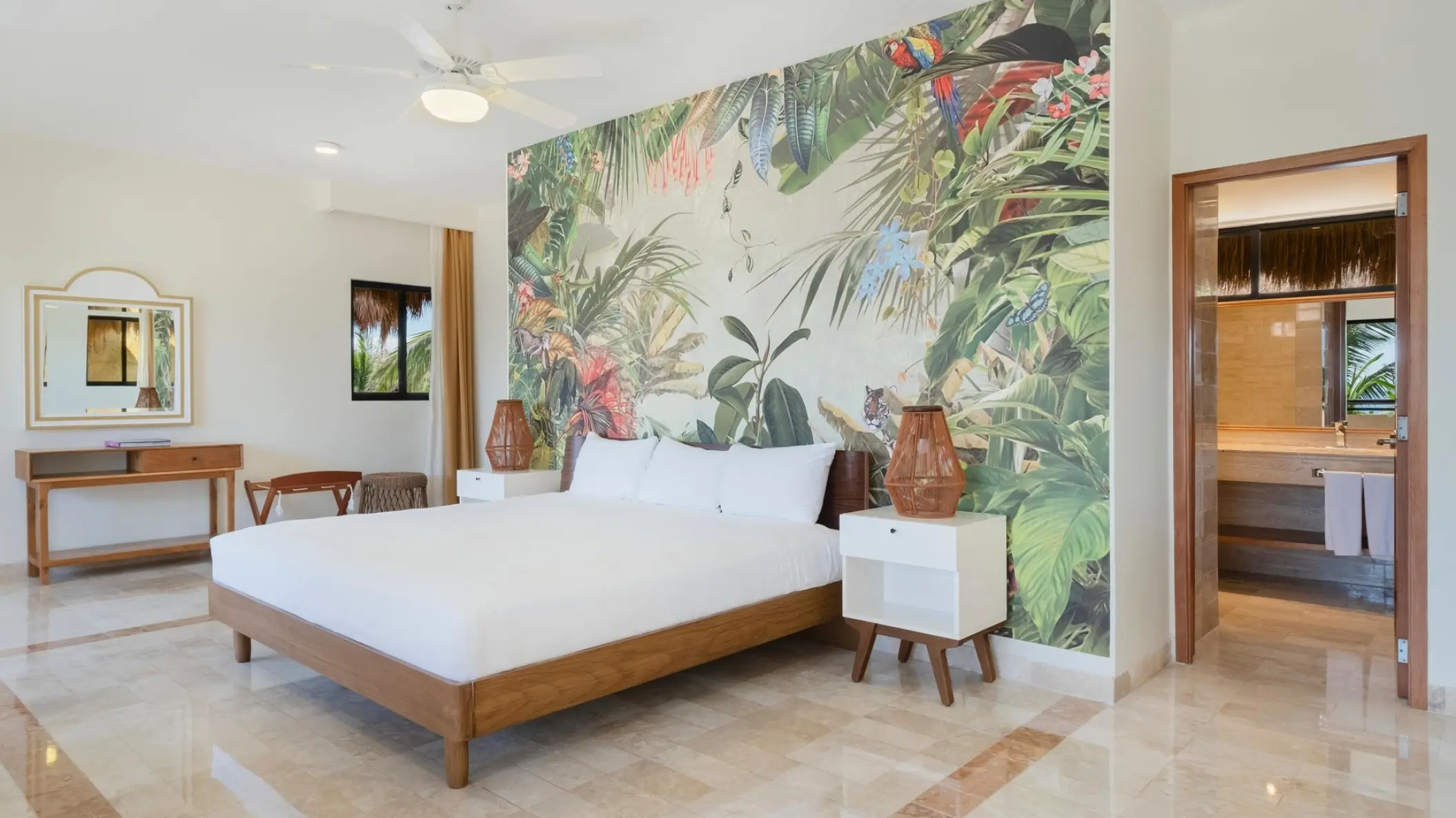 Guest room with tropical mural and wood accents at Iberostar Waves Quetzal, Playa Del Carmen