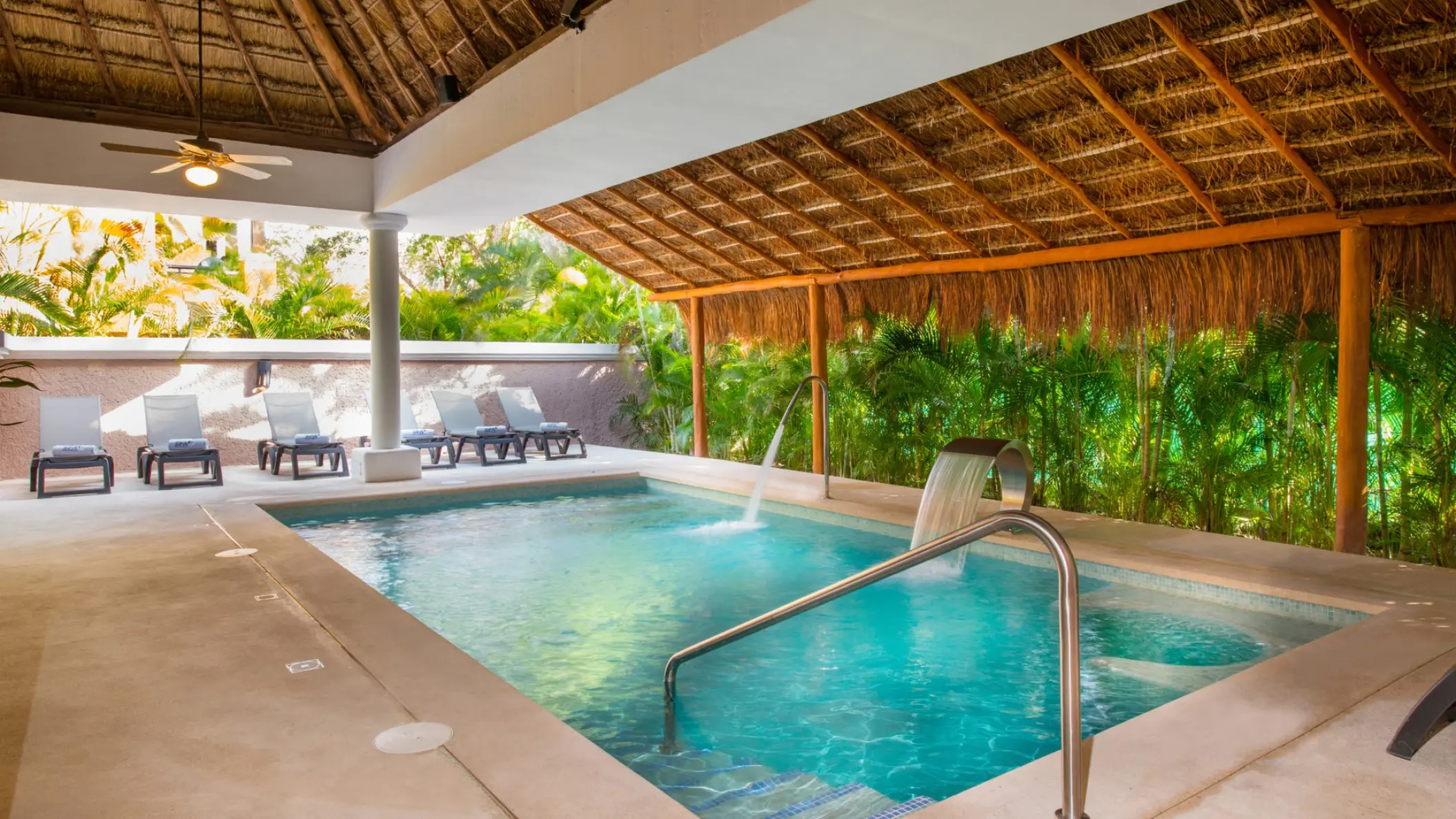 Iberostar Quetzal spa pool under a thatched roof with water fountains, Playa Del Carmen