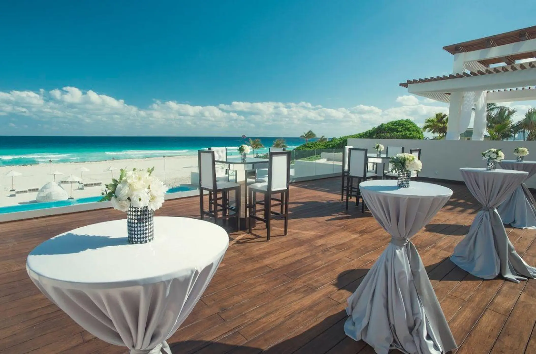 Cocktail wedding reception on the Coral Terrace at Iberostar Selection Cancun