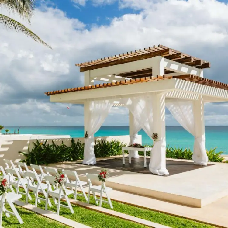 White gazebo wedding ceremony venue overlooking the ocean at Iberostar Selection Cancun
