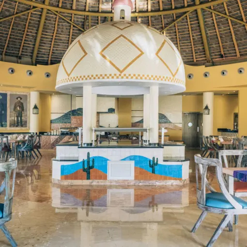 Buffet dining area under a thatched dome at Iberostar Selection Playa Mita, Puerto Vallarta