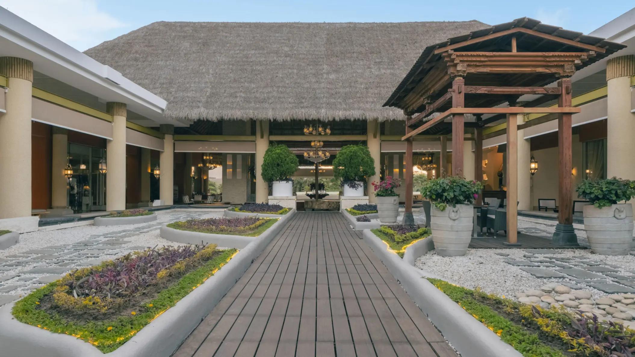 Iberostar Selection Playa Mita main entrance with thatched roof and landscaped walkway, Puerto Vallarta