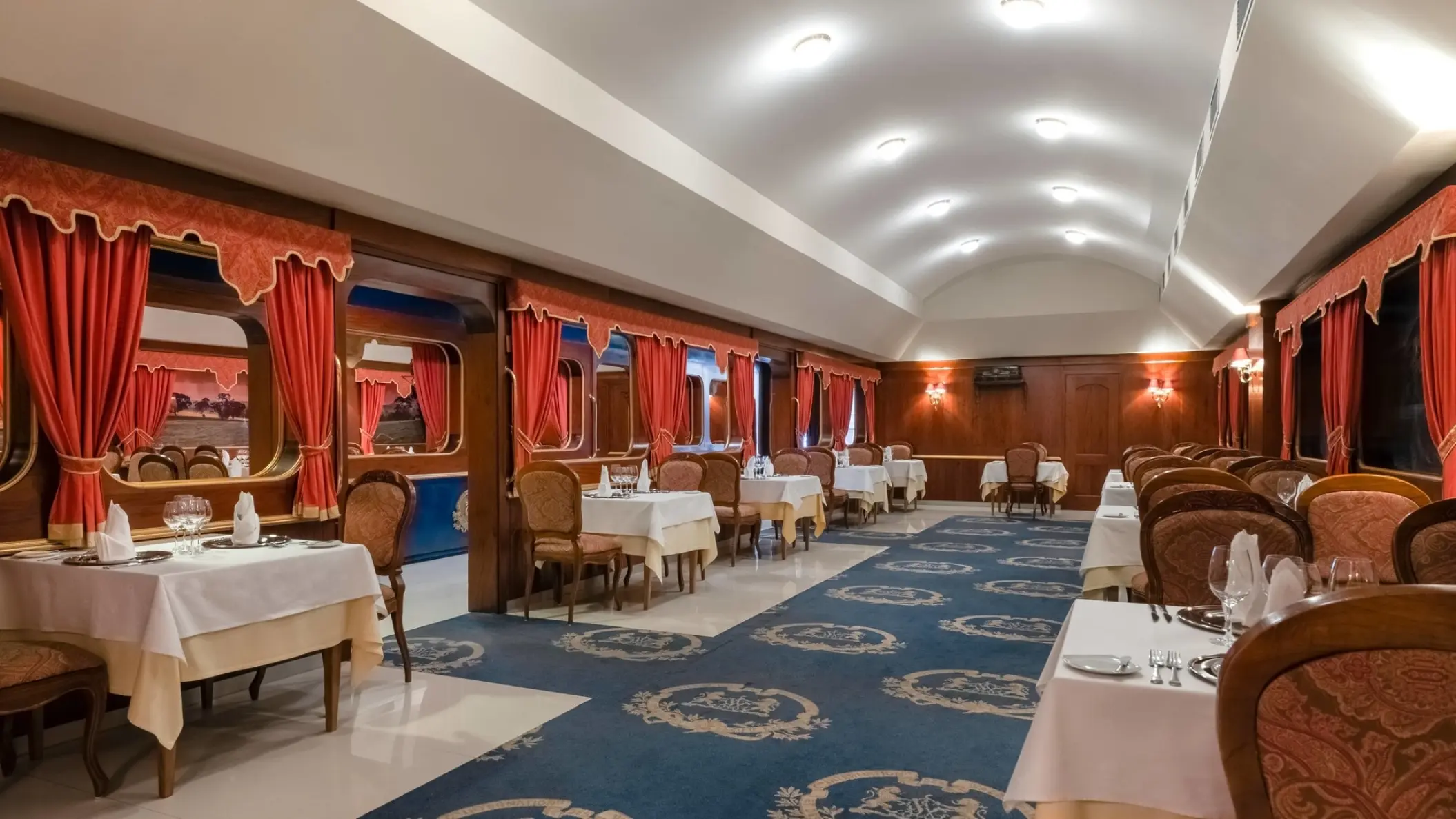 Iberostar Selection Playa Mita elegant indoor restaurant with red drapery and blue carpets, Puerto Vallarta