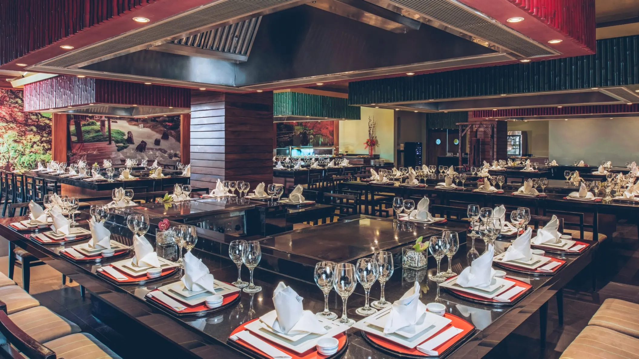 Teppanyaki dining tables with elegant place settings at Iberostar Selection Playa Mita, Puerto Vallarta