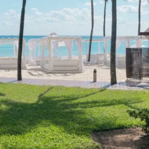 White beach cabanas on the sand at Iberostar Waves Tucan, Playa Del Carmen