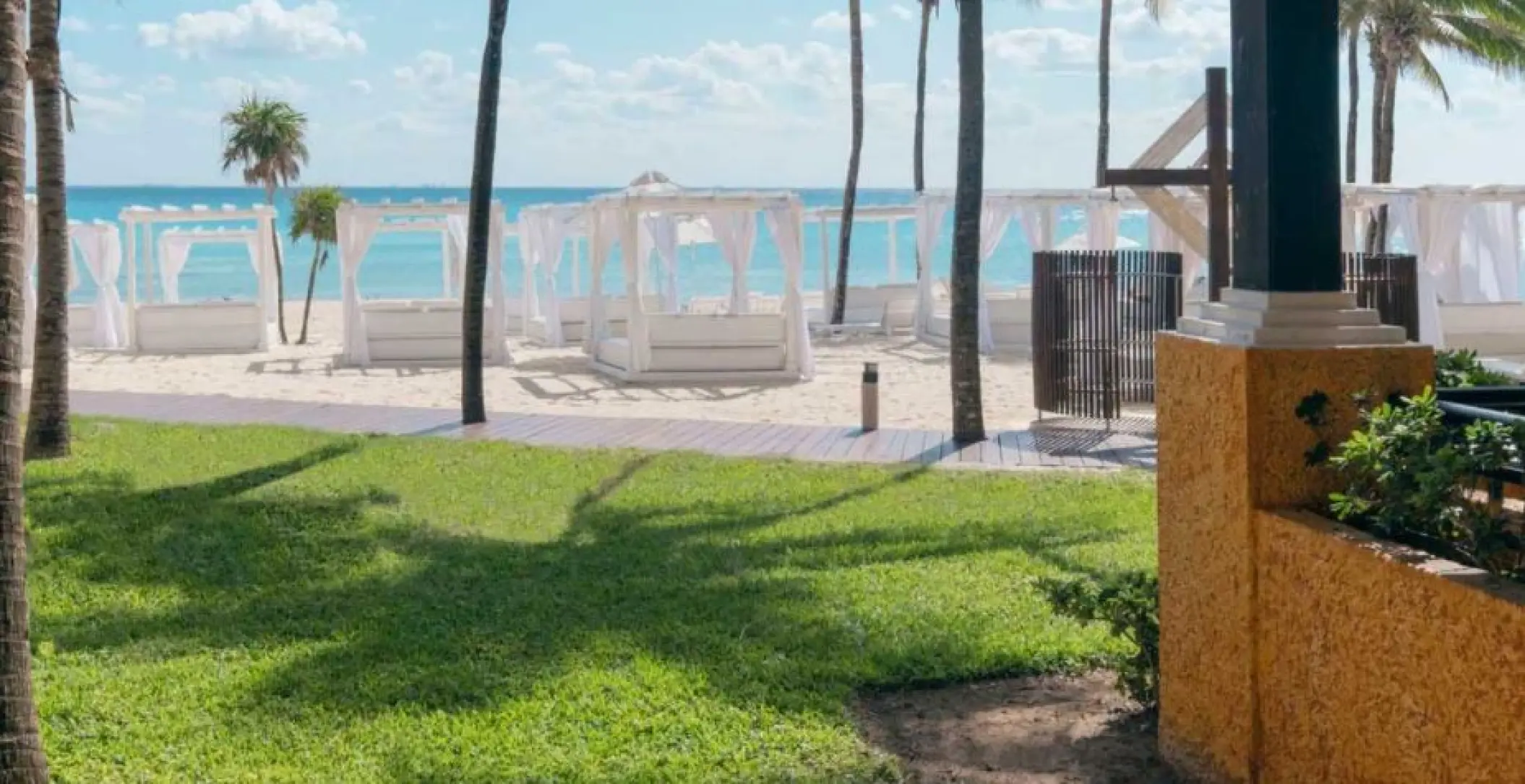 White beach cabanas on the sand at Iberostar Waves Tucan, Playa Del Carmen