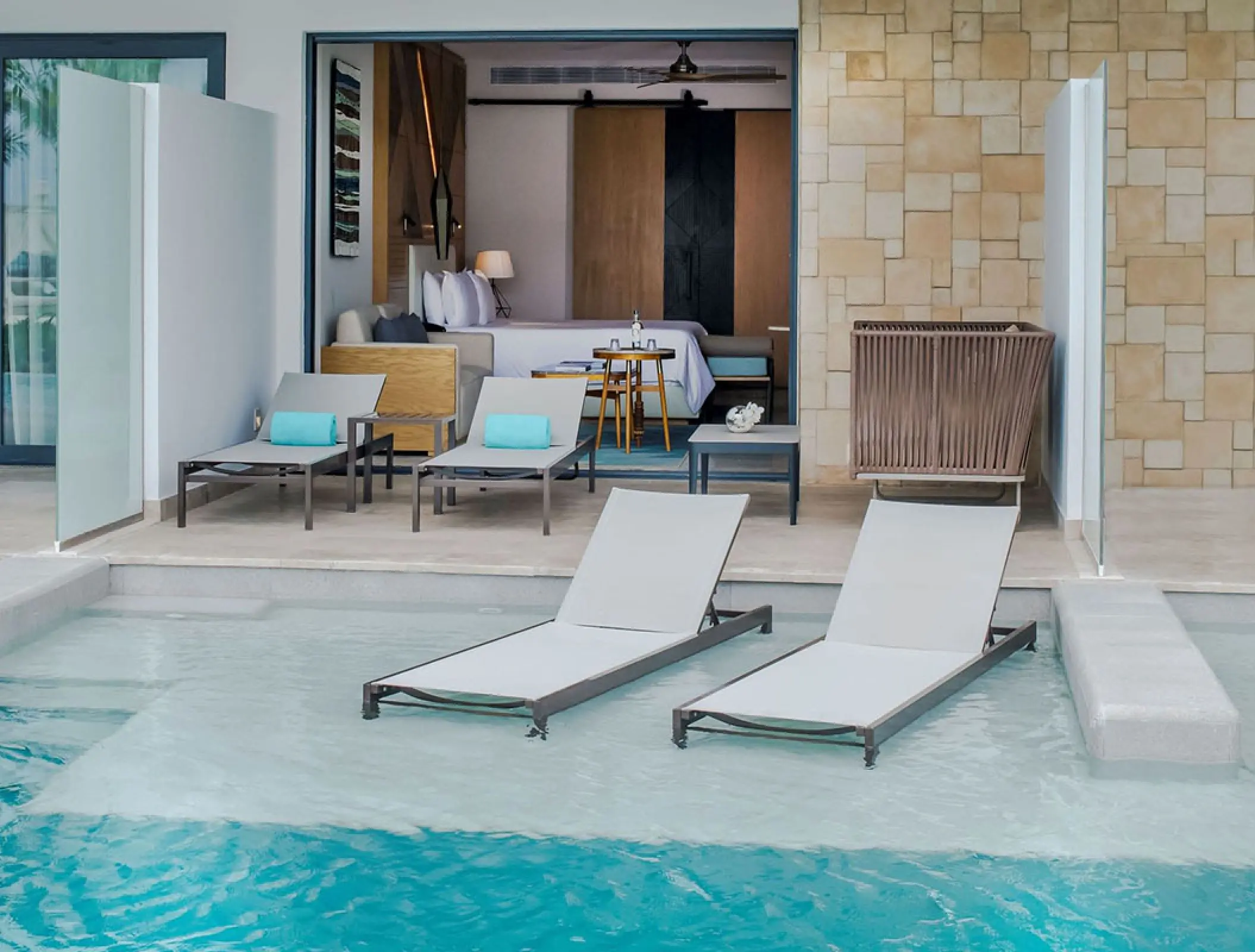 Junior suite swim-out room with terrace loungers at Haven Riviera Cancun, Riviera Maya