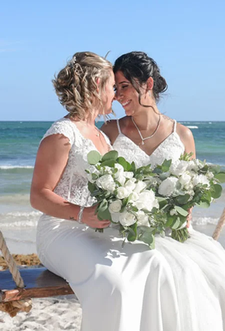 same sex couple enjoying at the beach