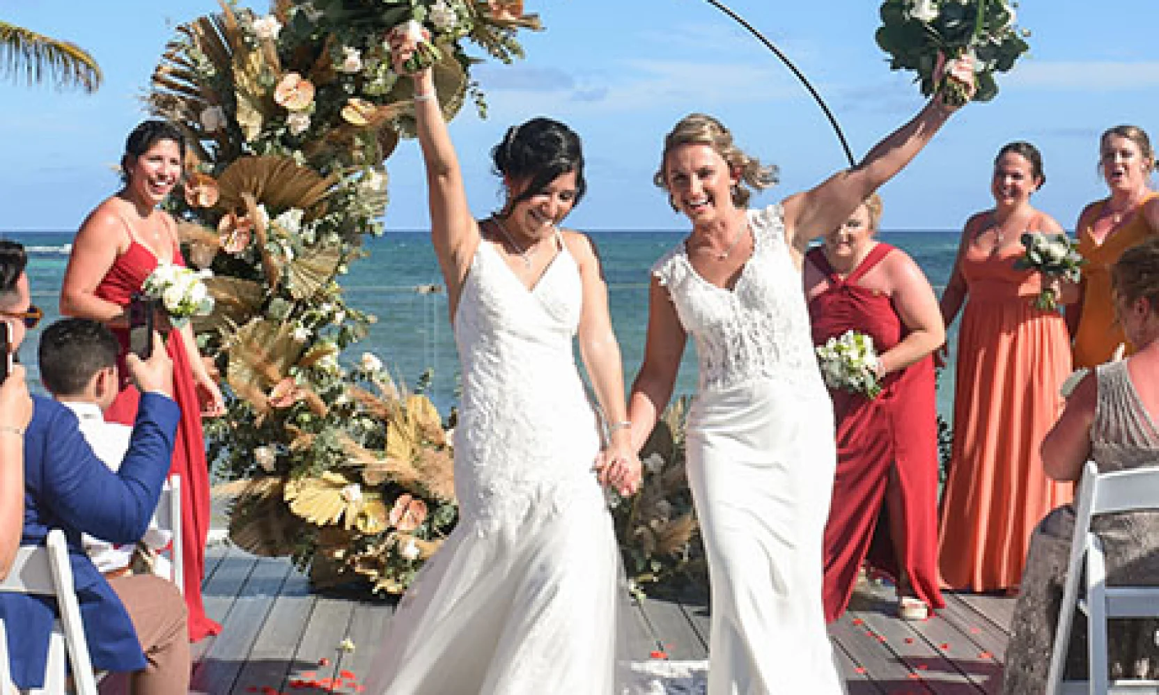 Wedding couple walks out the isle