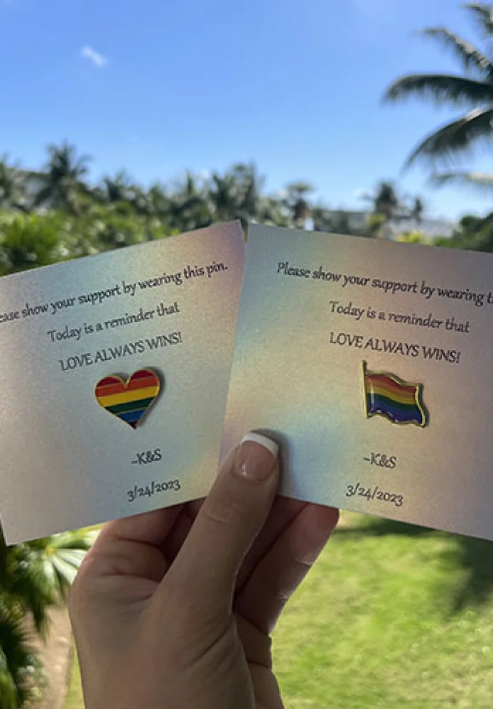 lgtb love pin wearied by guests on same sex wedding