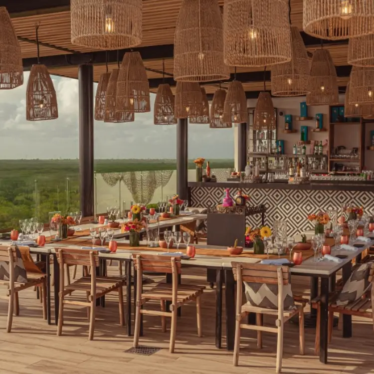 Rooftop reception venue with woven pendant lights at The Fives Oceanfront, Riviera Maya