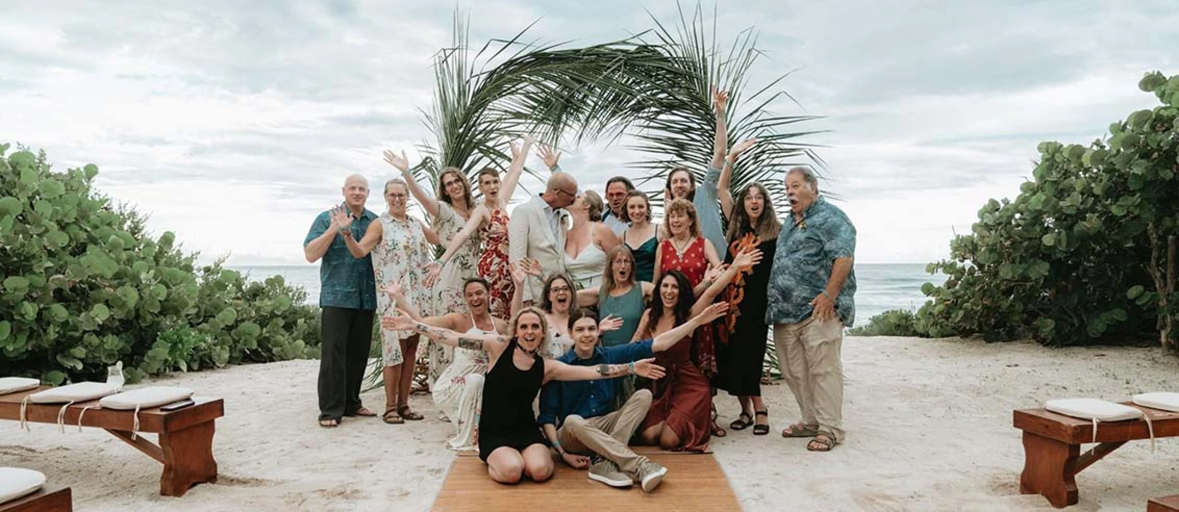 wedding group celebrating newlyweds