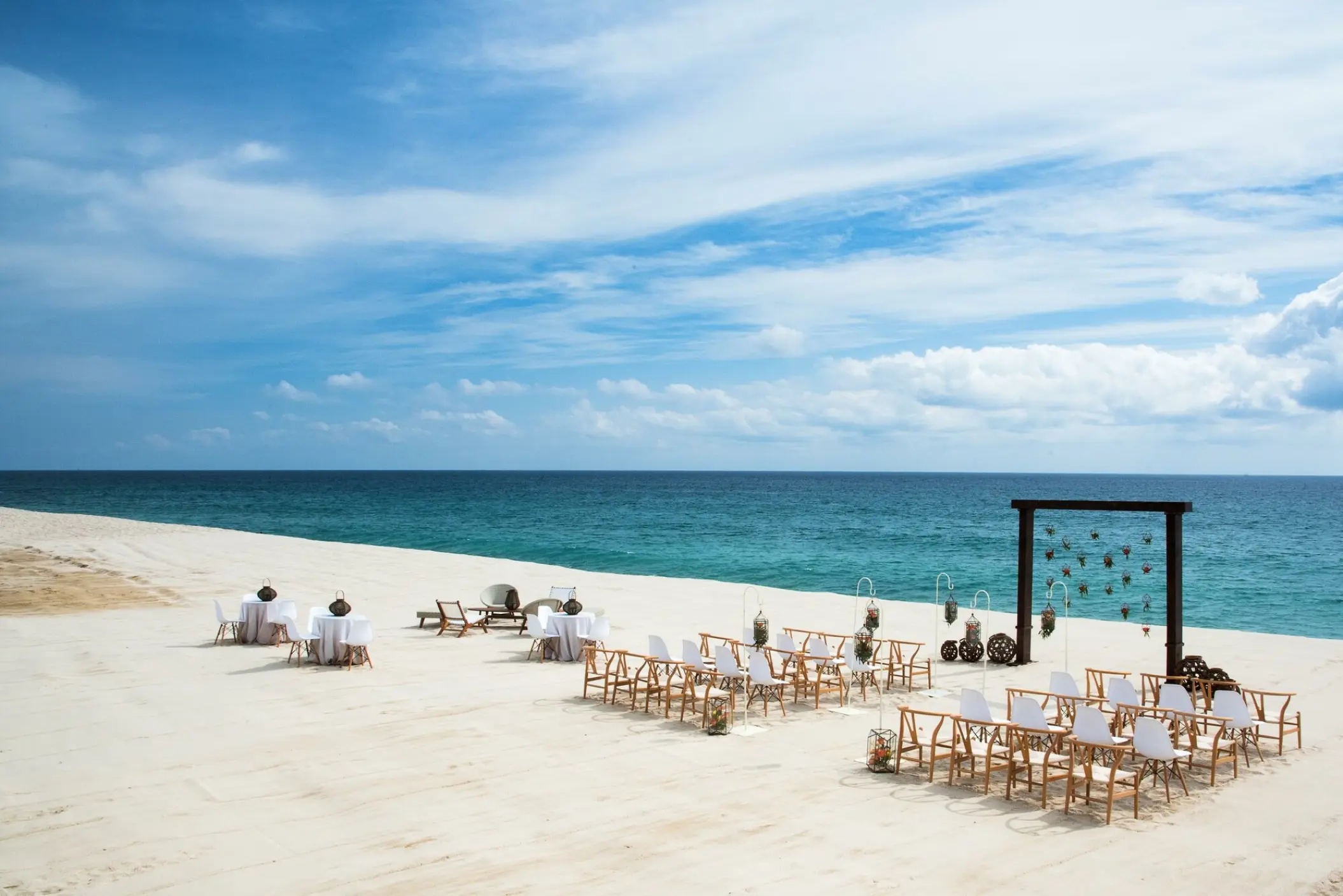 Beachfront wedding ceremony setup at Le Blanc Los Cabos, Cabo San Lucas
