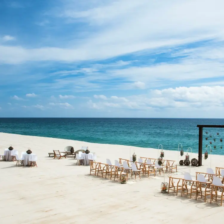 Beachfront wedding ceremony setup at Le Blanc Los Cabos, Cabo San Lucas