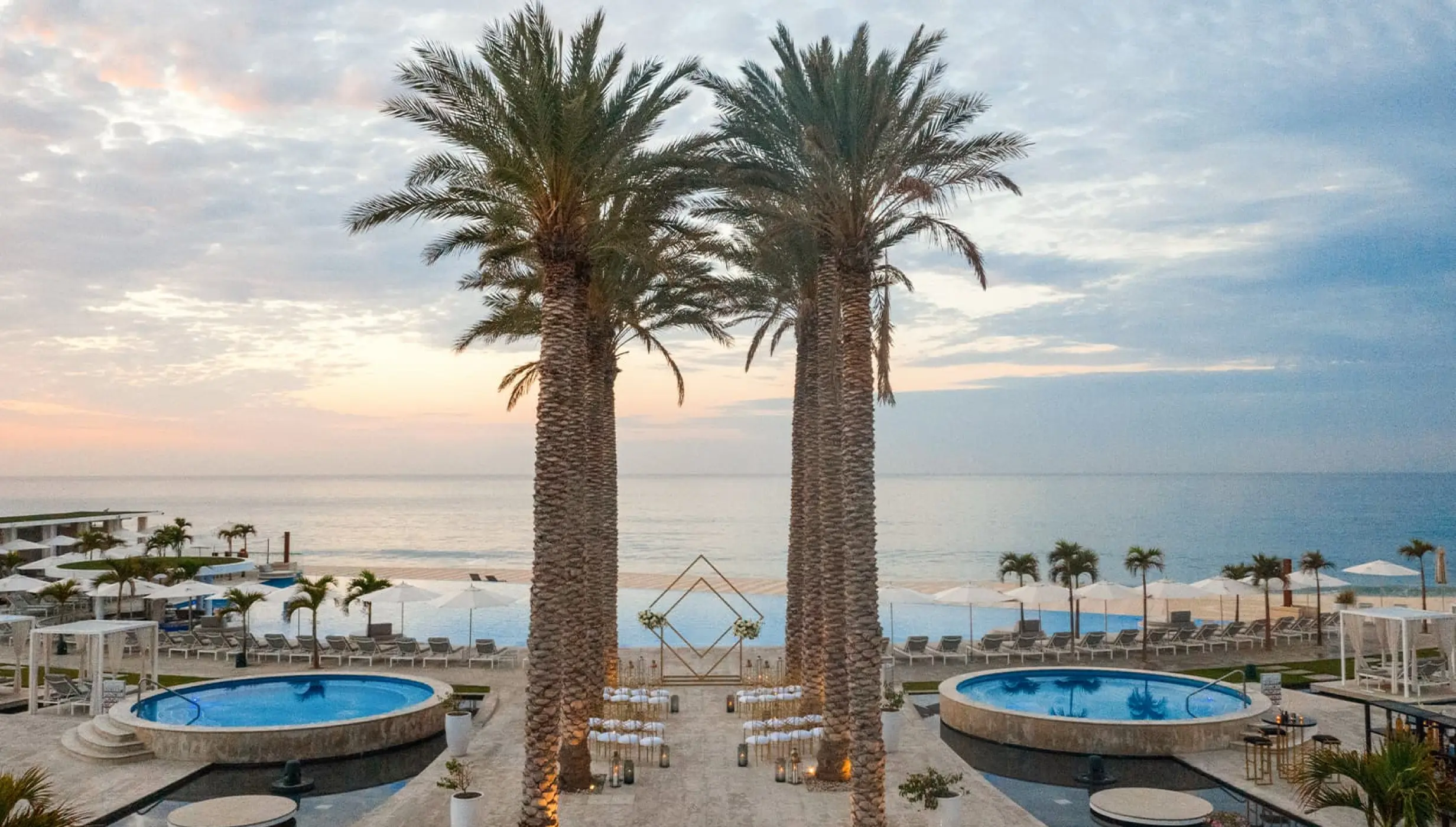 Ceremony decor on Pool terrace wedding venue at Le Blanc Spa Resort Los Cabos