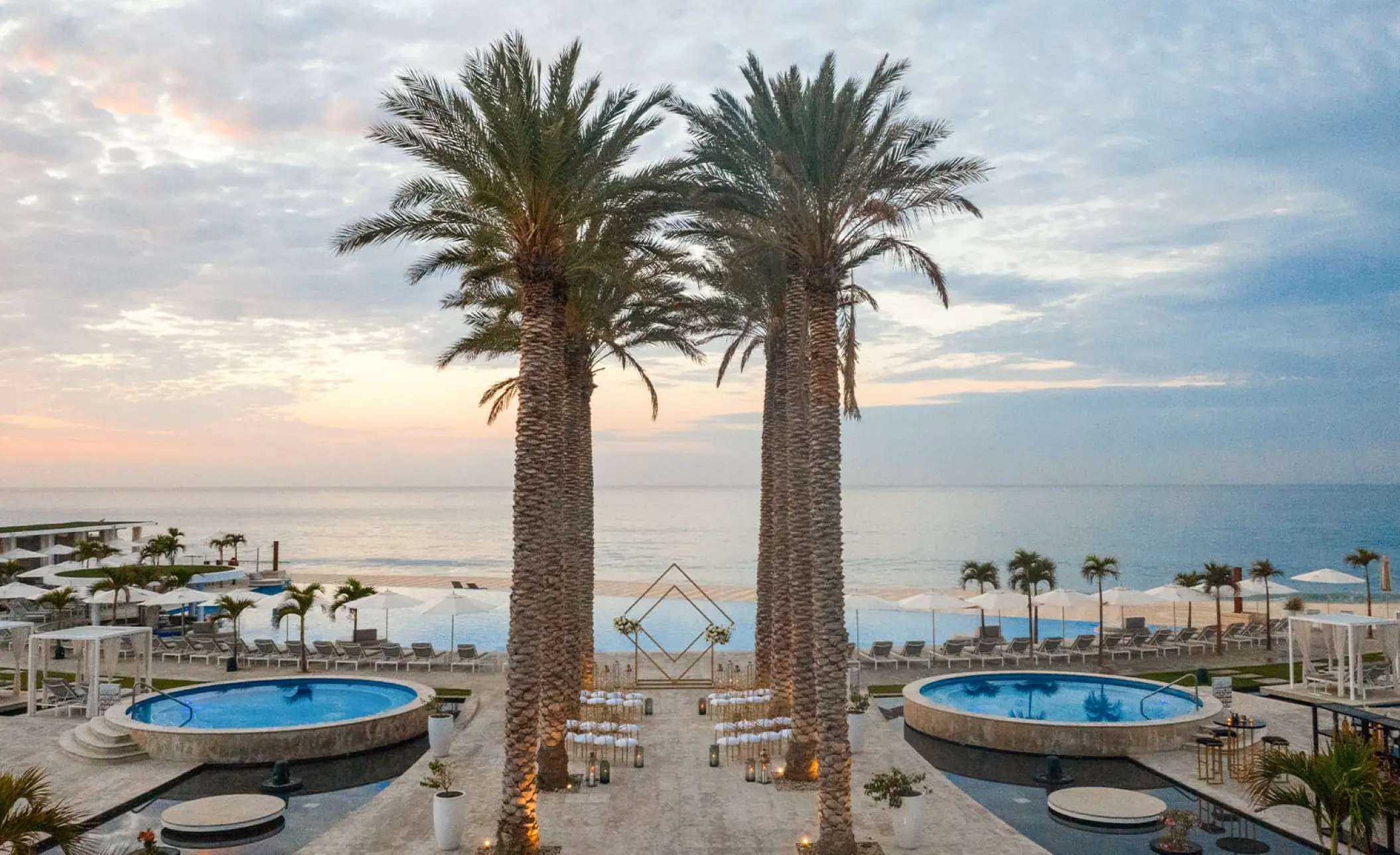 Terrace wedding ceremony setup by the pool at Le Blanc Los Cabos, Cabo San Lucas