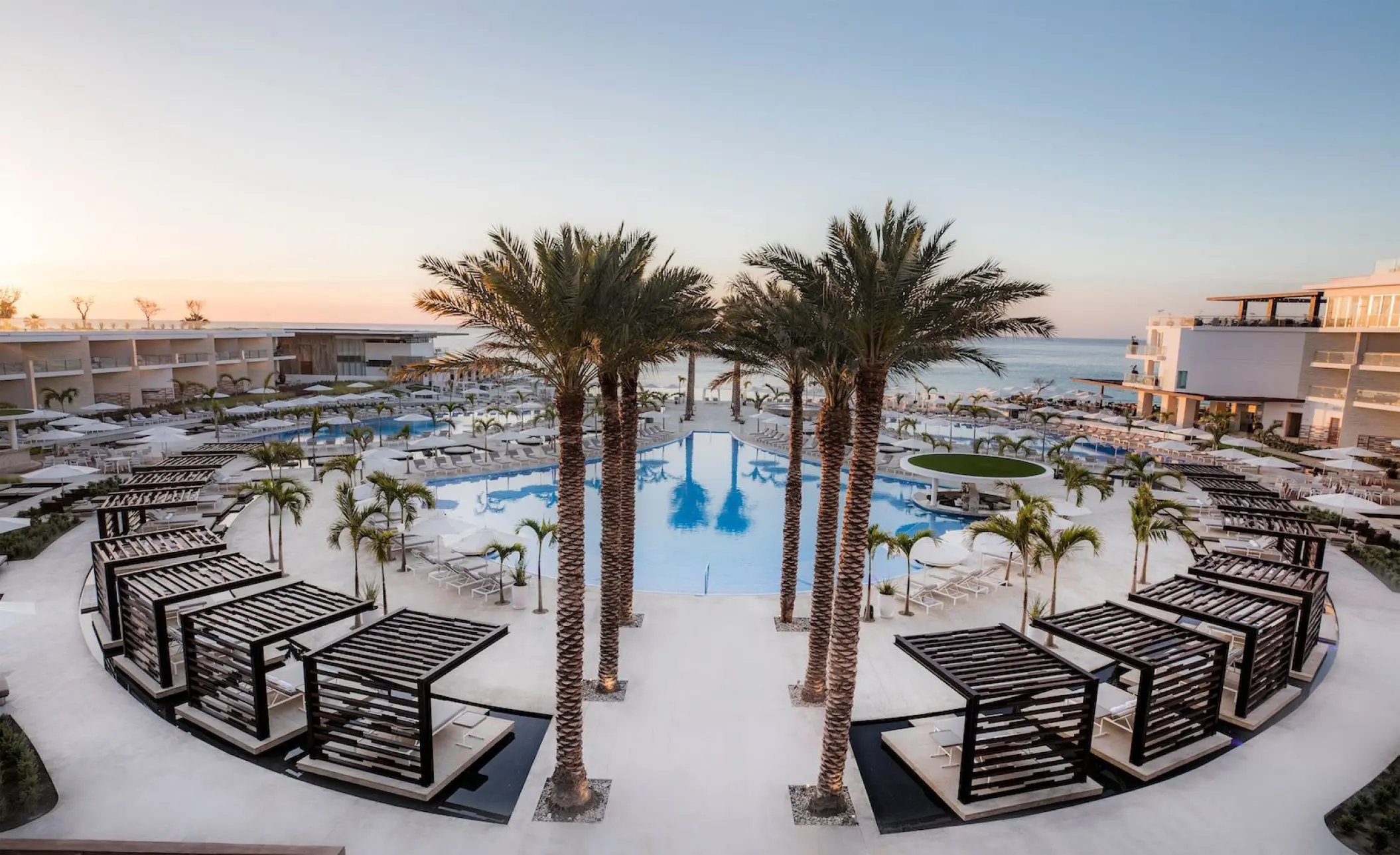 Le Blanc Spa Los Cabos main pool area with palm trees and modern cabanas, Cabo San Lucas