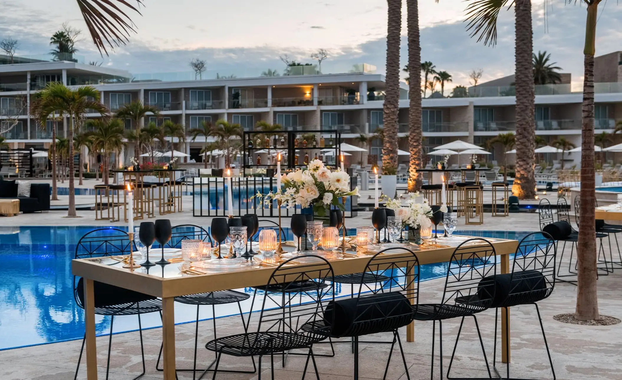 Outdoor wedding reception by the pool at Le Blanc Los Cabos, Cabo San Lucas