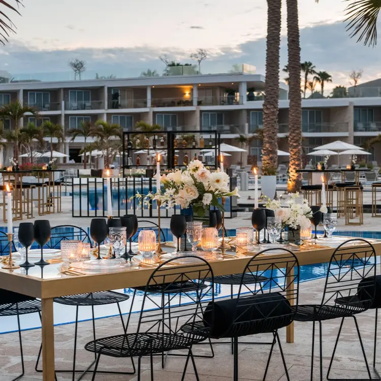 Outdoor wedding reception by the pool at Le Blanc Los Cabos, Cabo San Lucas