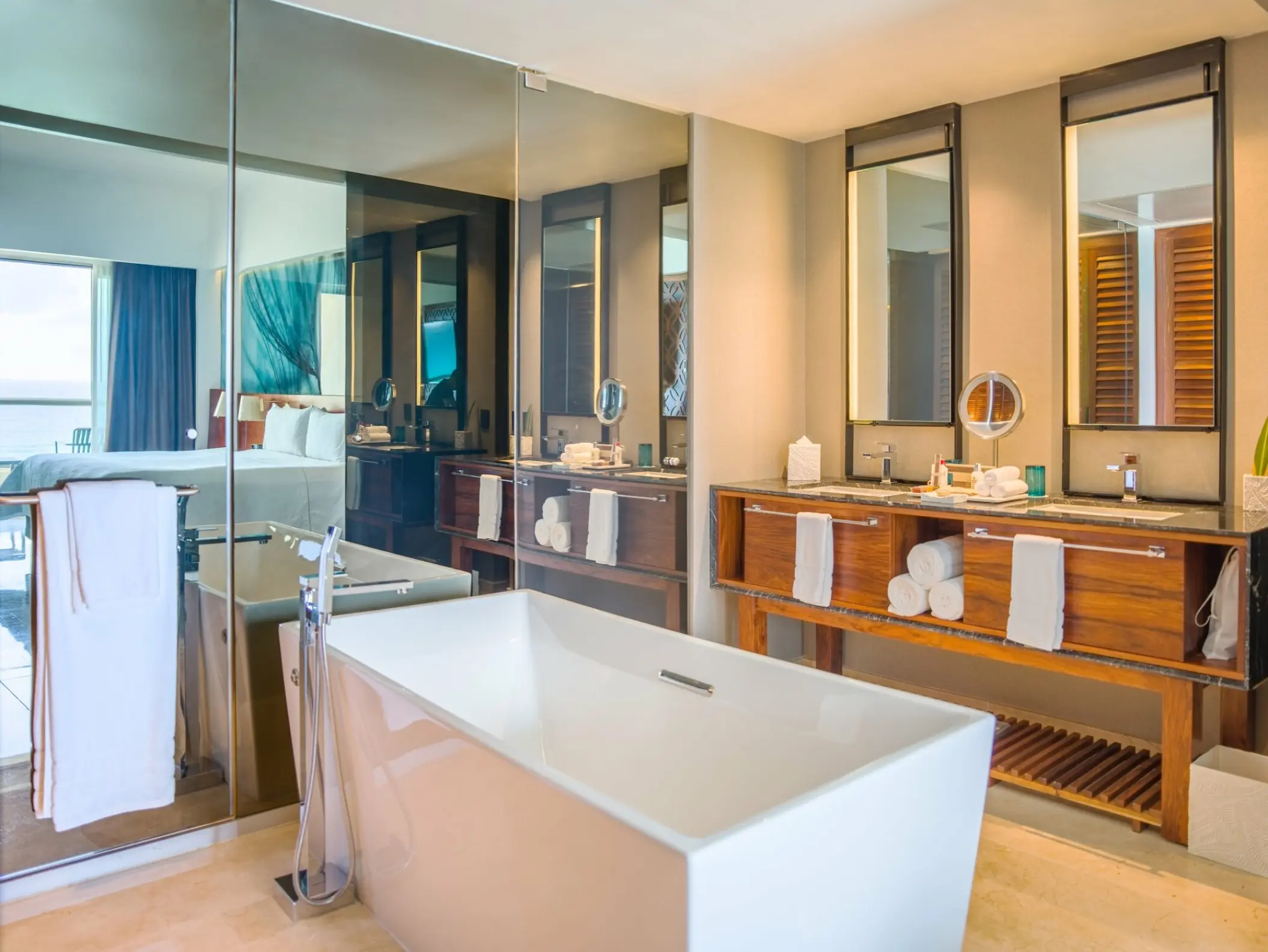 Viento Suite bathroom with freestanding soaking tub at Live Aqua Cancun