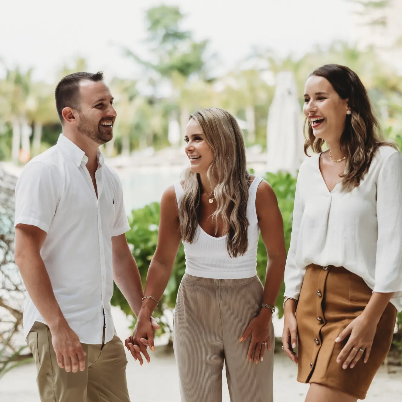 Paradise Weddings planner Lucie laughing with a couple at Secrets Moxche, Riviera Maya