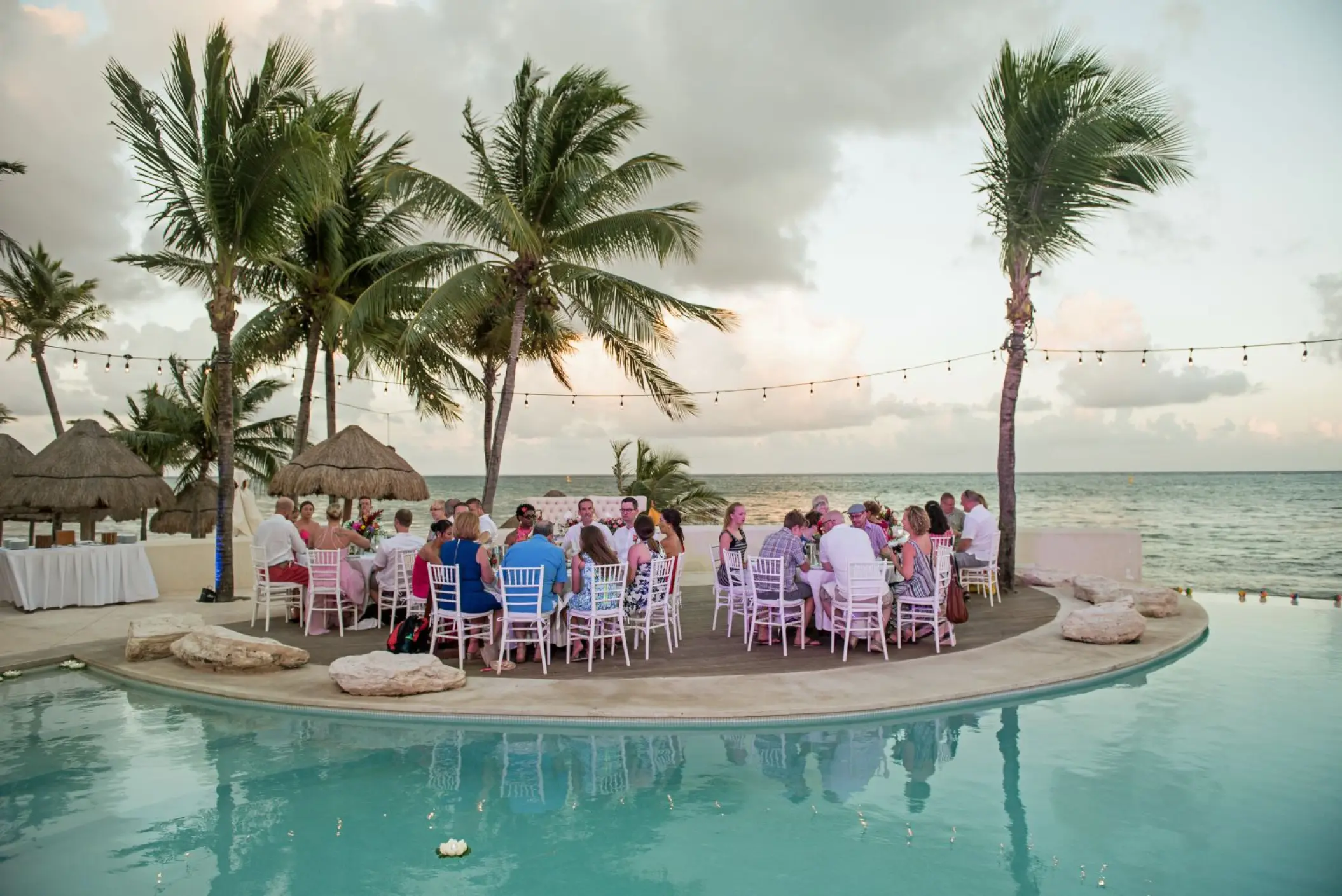 Poolside wedding reception dinner at Mahekal Beach Resort, Playa Del Carmen