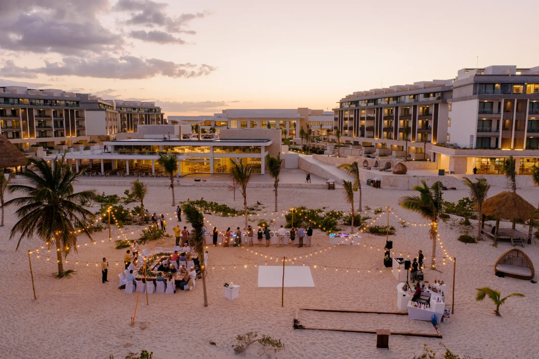 Beach wedding reception with string lights at Majestic Elegance Costa Mujeres, Cancun