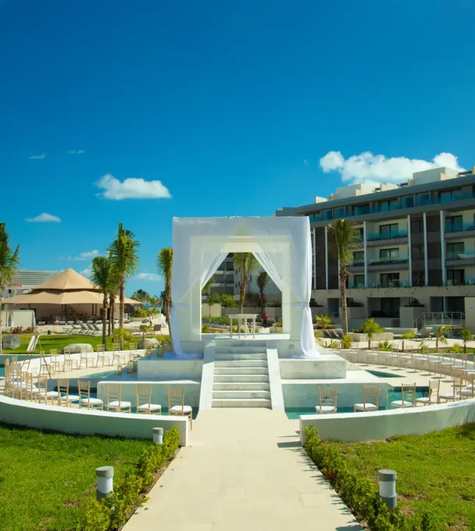 Garden wedding ceremony gazebo with white draping at Majestic Elegance Costa Mujeres, Cancun