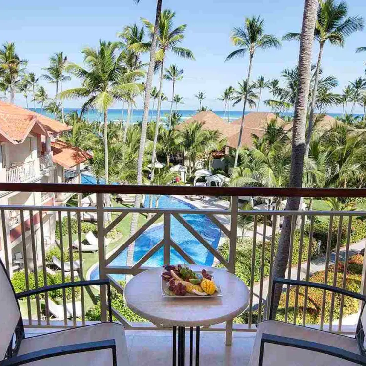 Majestic Elegance Punta Cana suite terrace overlooking the pool and tropical grounds