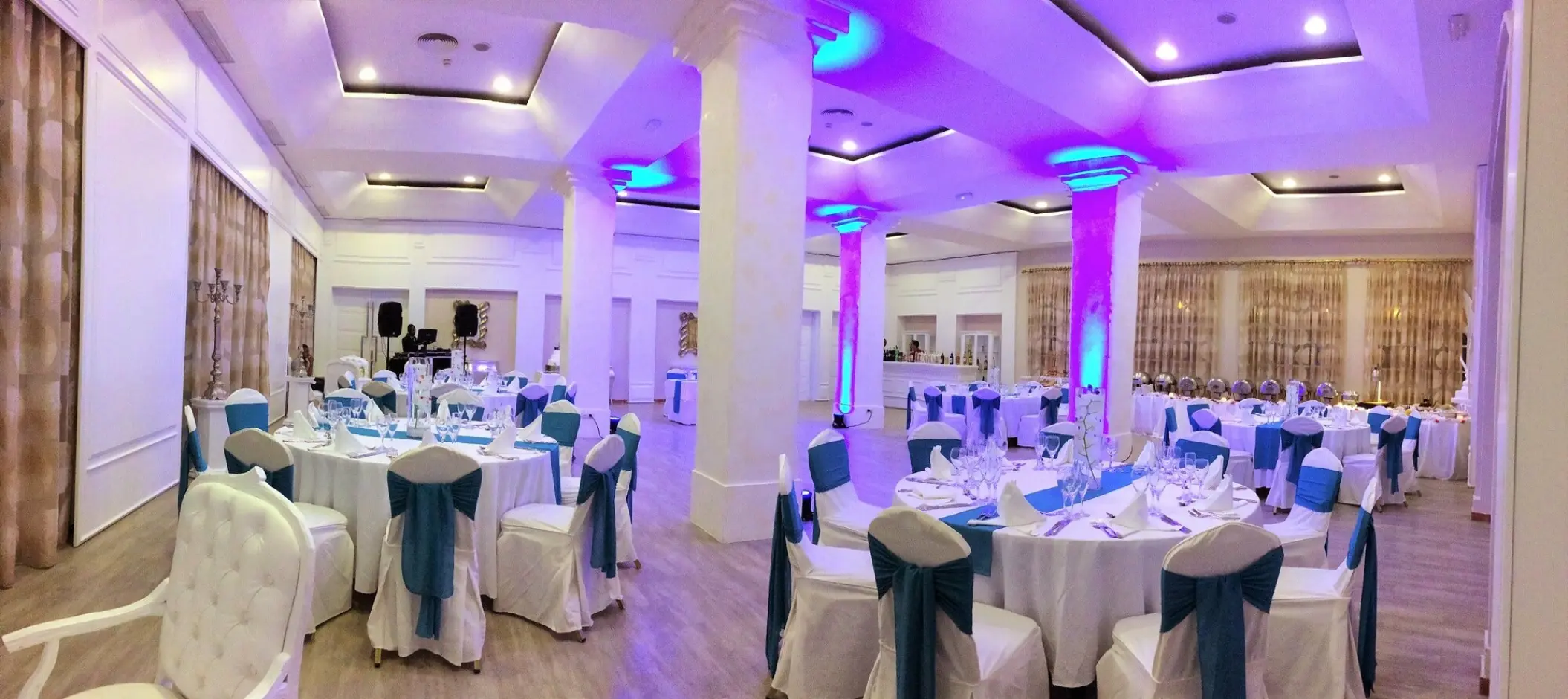 Indoor wedding reception with blue and white decor in the ballroom at Majestic Elegance, Punta Cana