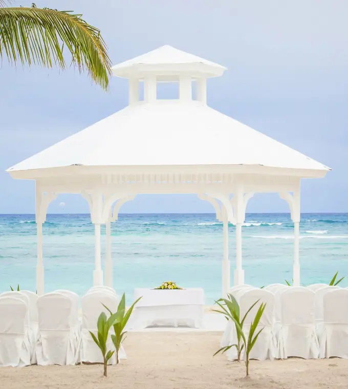 White beach gazebo wedding ceremony setup at Majestic Elegance, Punta Cana