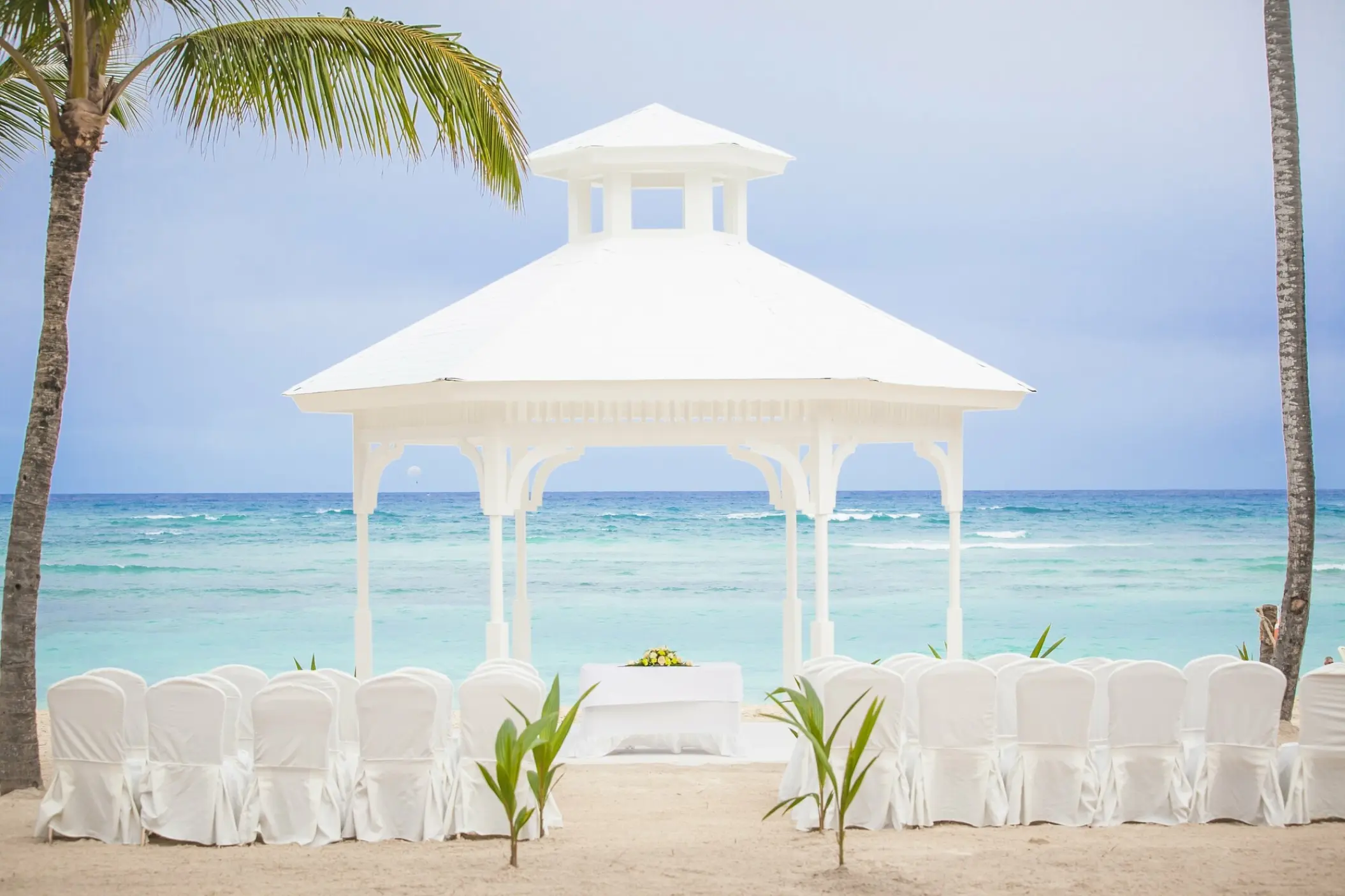 White beach gazebo wedding ceremony setup at Majestic Elegance, Punta Cana