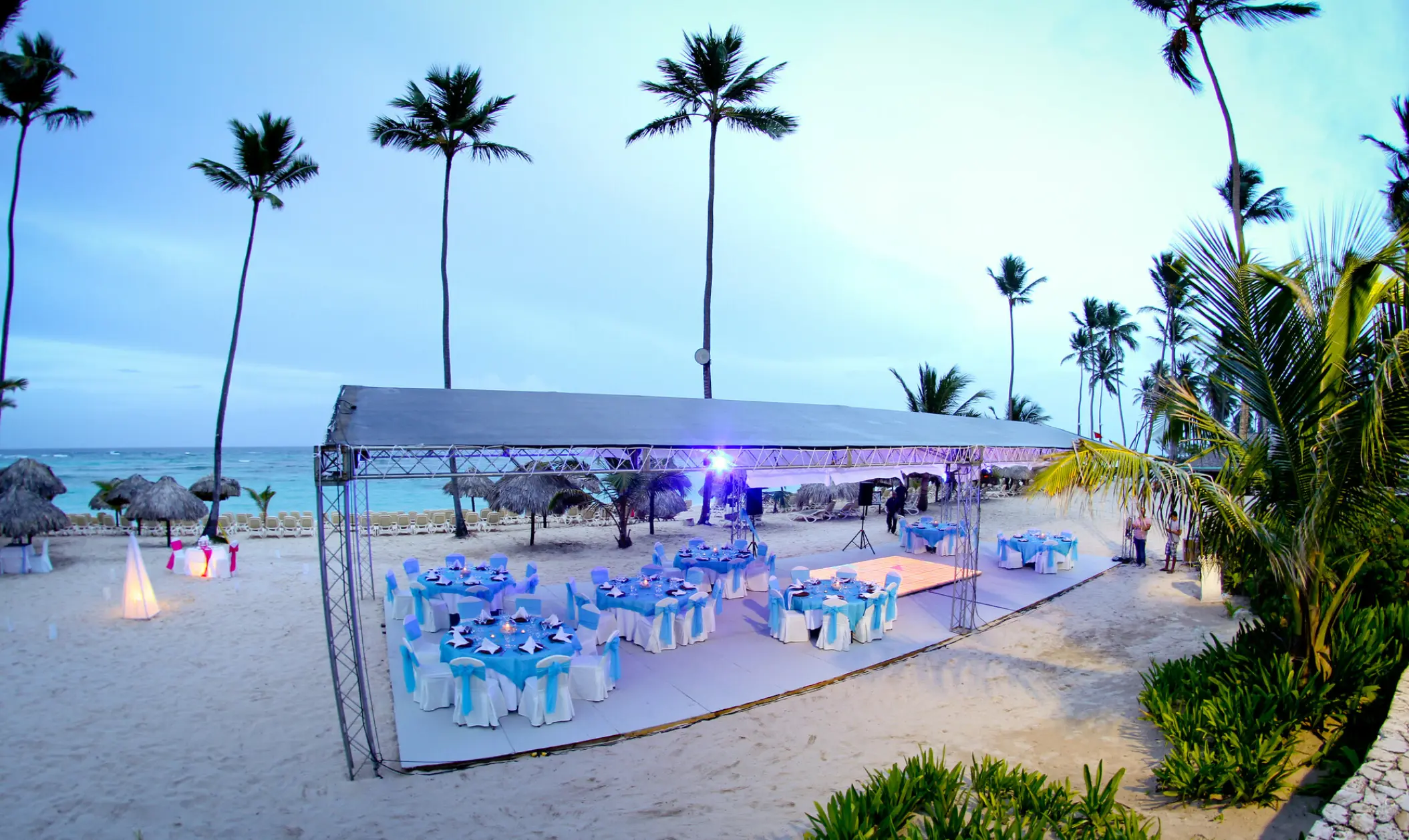 Beach wedding reception setup under a canopy at Majestic Elegance, Punta Cana