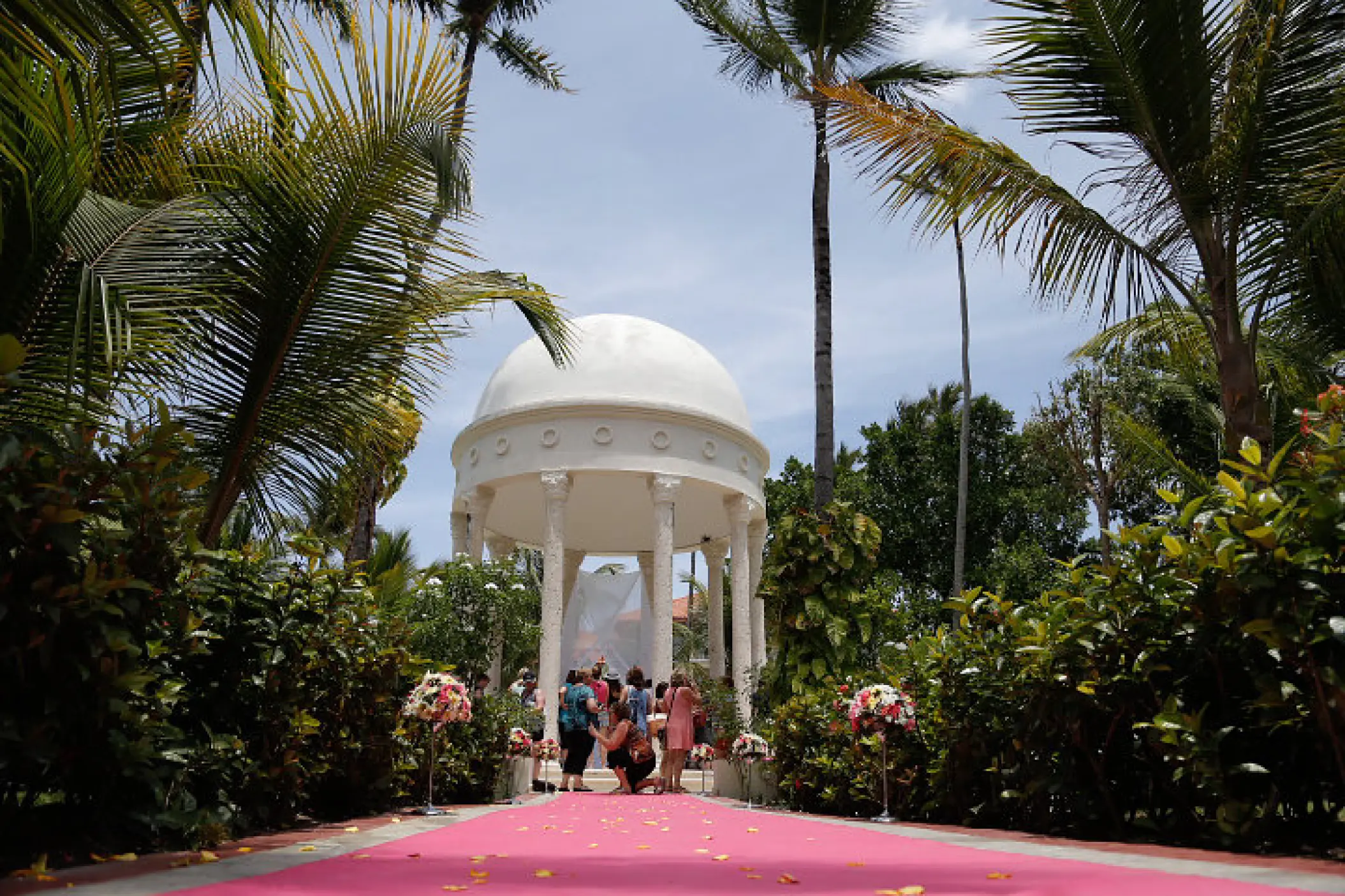 Garden gazebo wedding ceremony with pink aisle at Majestic Elegance, Punta Cana