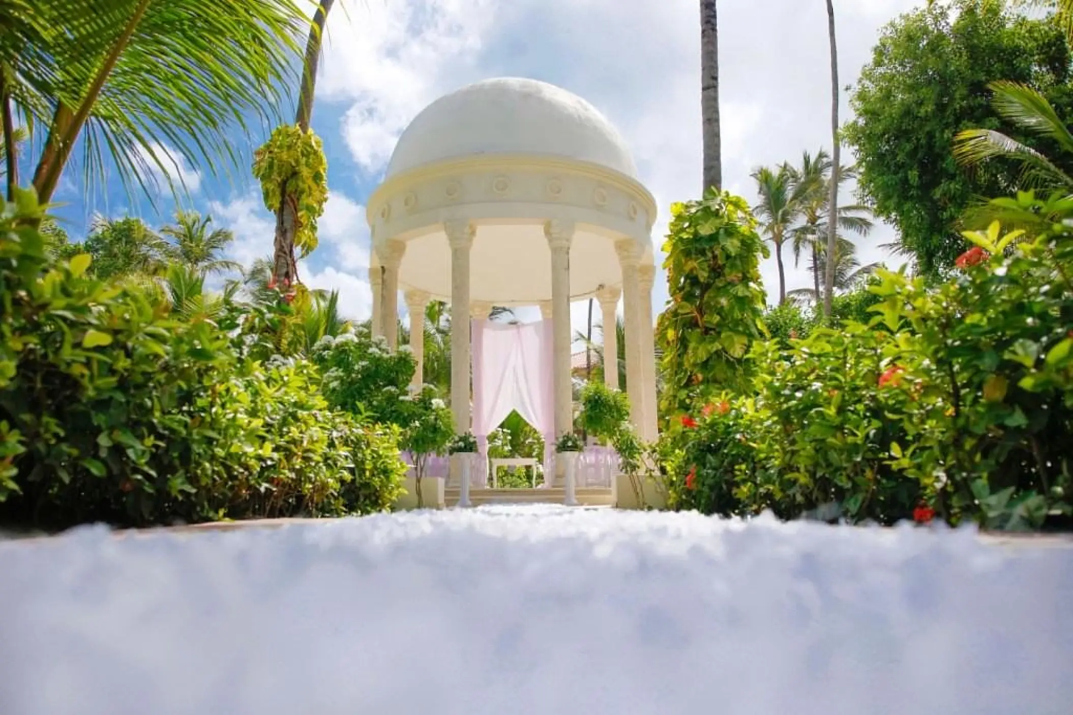 White garden gazebo wedding ceremony venue at Majestic Elegance, Punta Cana