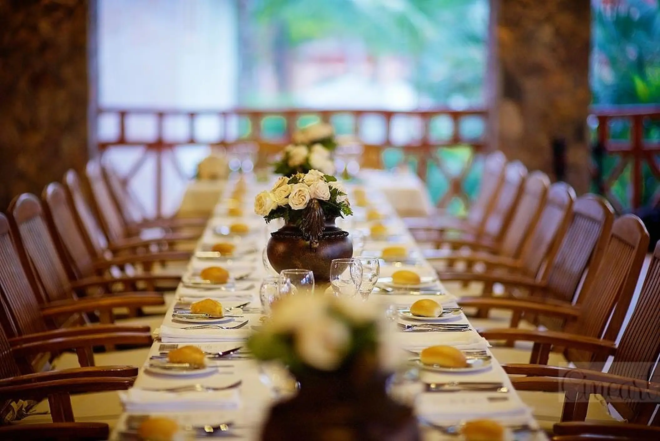 Long wedding reception table with floral centerpieces at Majestic Elegance Punta Cana