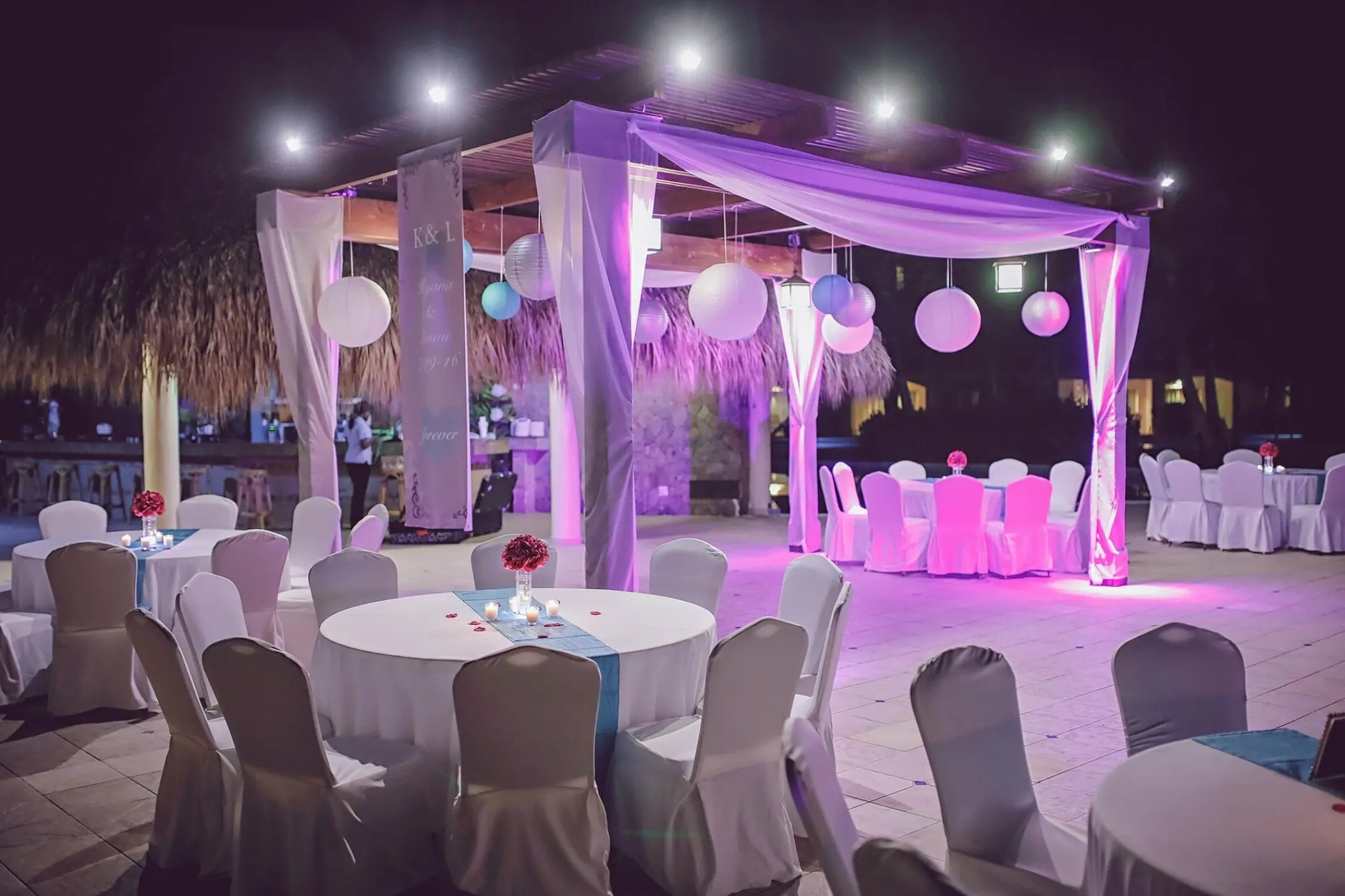 Evening wedding reception under a lighted gazebo at Majestic Elegance, Punta Cana