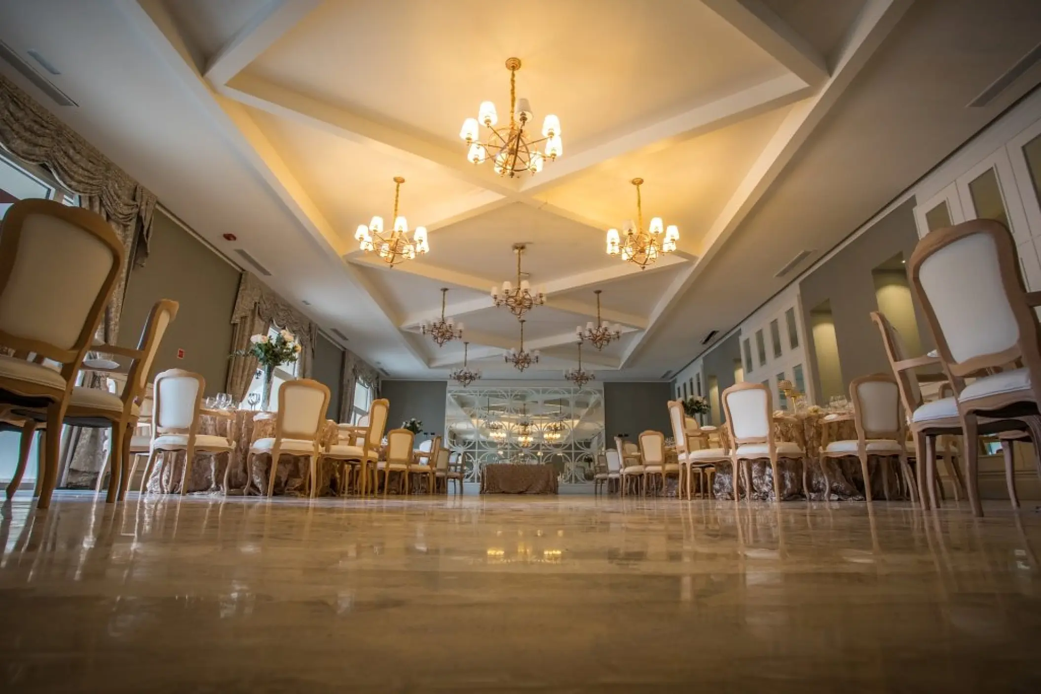 Ballroom wedding reception with chandeliers and formal seating at Majestic Mirage, Punta Cana
