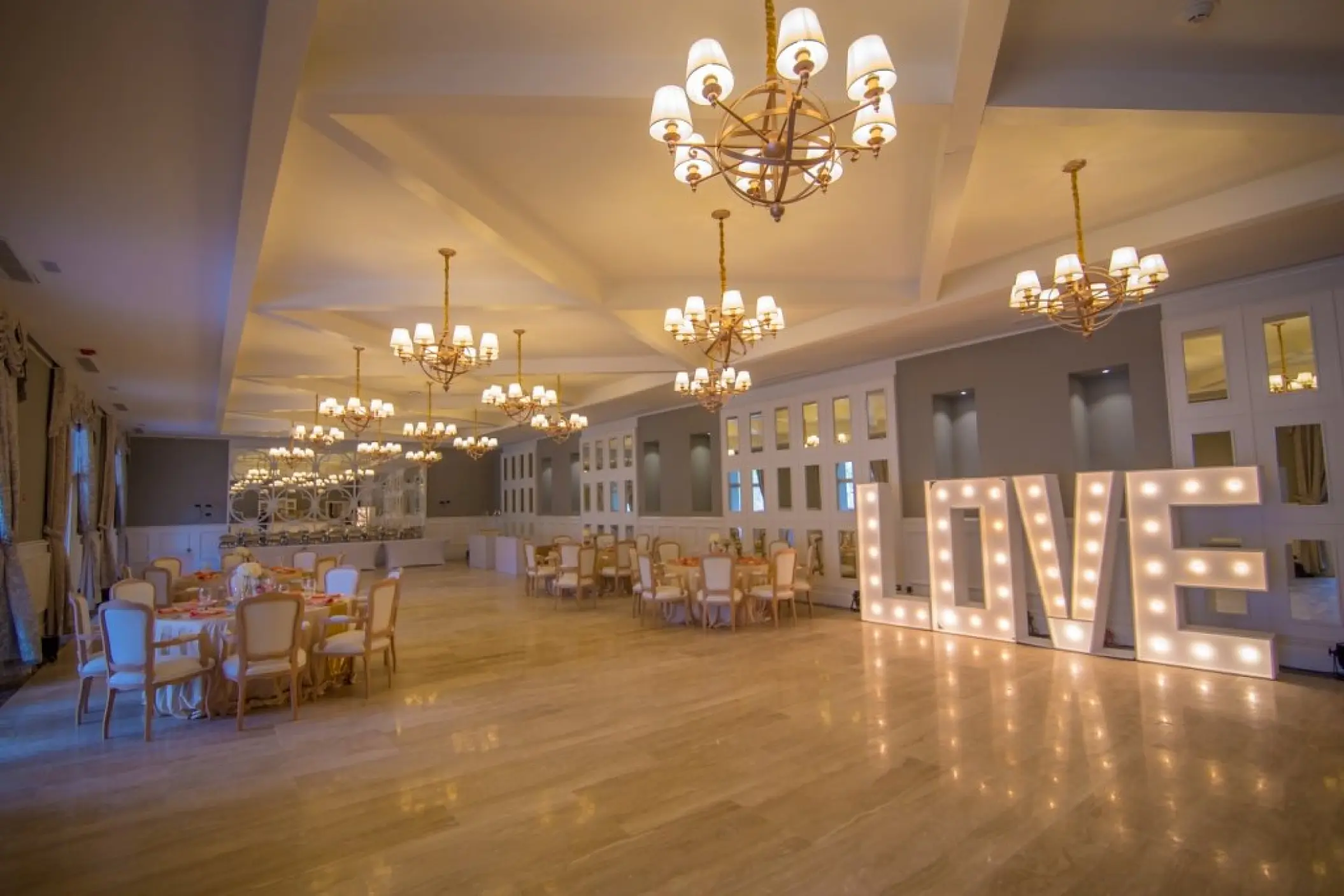 Ballroom wedding reception at Majestic Mirage, Punta Cana featuring lighted marquee LOVE letters